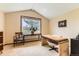 Bright office space with vaulted ceilings, neutral walls, and plenty of natural light at 6351 S Andes Pl, Centennial, CO 80016