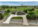 An aerial shot of a home with a detached garage, lots of land and a very long driveway at 16110 Poplar St, Brighton, CO 80602