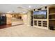 Finished basement with a bar, TV and speakers, perfect for entertaining guests at 16110 Poplar St, Brighton, CO 80602