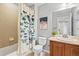 Full bathroom with tiled shower, a toilet, and a single sink at 16110 Poplar St, Brighton, CO 80602