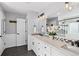 Modern bathroom featuring double sinks, a large mirror, and stylish lighting at 16110 Poplar St, Brighton, CO 80602