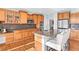 Spacious kitchen with stainless steel appliances, wooden cabinets and granite countertops at 16110 Poplar St, Brighton, CO 80602