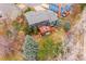 Large lot with mature trees, sprawling backyard, patio, and deck with view at 4 Mountain Ash, Littleton, CO 80127