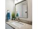 Stylish bathroom vanity with granite countertop, modern faucet, and decorative mirror at 4 Mountain Ash, Littleton, CO 80127