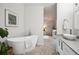 This elegant bathroom features a freestanding soaking tub and stylish vanity at 4 Mountain Ash, Littleton, CO 80127