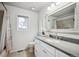 Cozy bathroom features a framed mirror and granite vanity with plenty of space at 4 Mountain Ash, Littleton, CO 80127