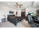 Bedroom featuring ceiling fan, comfortable bed, and workspace for ultimate relaxation and productivity at 4 Mountain Ash, Littleton, CO 80127