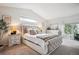 Bright bedroom with a vaulted ceiling, soft carpet, and neutral tones offers a peaceful retreat at 4 Mountain Ash, Littleton, CO 80127