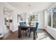 Elegant dining room featuring a modern chandelier, large window, and stylish decor at 4 Mountain Ash, Littleton, CO 80127