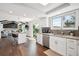 Bright kitchen with white cabinetry, granite countertops, and stainless steel appliances at 4 Mountain Ash, Littleton, CO 80127