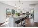Spacious kitchen island with bar seating, pendant lighting, and access to the outdoor deck at 4 Mountain Ash, Littleton, CO 80127
