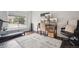 Functional office space with multiple monitors, a treadmill, and ample natural light at 4 Mountain Ash, Littleton, CO 80127