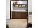 Cozy bar area featuring custom cabinets, shelving, a sink, and stylish decor at 11210 Parliament Way, Parker, CO 80138