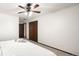 Simple bedroom with a ceiling fan and a large closet at 11210 Parliament Way, Parker, CO 80138