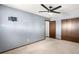 Bedroom with carpet flooring, ceiling fan, and standard closet at 11210 Parliament Way, Parker, CO 80138