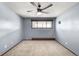 Bright bedroom with neutral carpet, ceiling fan, and a sunlit window at 11210 Parliament Way, Parker, CO 80138