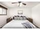 Bright bedroom features a bed with pillows and matching nightstands at 11210 Parliament Way, Parker, CO 80138