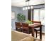 Dining room featuring a wooden table with stylish chairs and a view out the window at 11210 Parliament Way, Parker, CO 80138