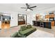 Bright living room featuring a view of the bar, kitchen, and fireplace at 11210 Parliament Way, Parker, CO 80138