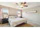 Comfortable bedroom featuring a ceiling fan and a decorative wall sign at 4459 S Independence Ct, Littleton, CO 80123