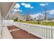 Well-maintained backyard with a manicured lawn, a privacy fence, and a charming curb appeal at 8040 S Culebra Peak, Littleton, CO 80127