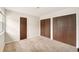 Cozy bedroom with ample closet space, soft carpet, and neutral walls, offering a blank canvas at 8040 S Culebra Peak, Littleton, CO 80127