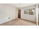 Bright bedroom with a large window, neutral carpet and walls, and natural light, creating a calm atmosphere at 8040 S Culebra Peak, Littleton, CO 80127