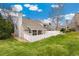 Charming home exterior with a well-kept lawn, mature trees, and a privacy fence, offering serene outdoor living at 8040 S Culebra Peak, Littleton, CO 80127