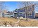 Exterior of the home features a well-manicured lawn and a large shade tree at 1114 Lasnik St, Erie, CO 80516