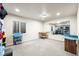 Unfinished basement space with carpeting, a large mirror, and storage shelving at 1114 Lasnik St, Erie, CO 80516