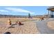 Scenic backyard with decorative rocks, a wooden fence, a small tree and a view of the mountains in the distance at 16525 Sanford St, Mead, CO 80542