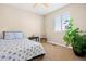 Bright bedroom with a comfy bed, large window, and a charming plant, offering a cozy retreat at 16525 Sanford St, Mead, CO 80542