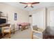 Bedroom featuring a ceiling fan, a small desk, and a closet space for a versatile setup at 16525 Sanford St, Mead, CO 80542