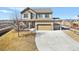 Two-story home featuring a spacious three-car garage, large driveway and covered porch at 16525 Sanford St, Mead, CO 80542