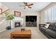 Inviting living room with a fireplace, plush seating, and entertainment center, perfect for Gathering gatherings at 16525 Sanford St, Mead, CO 80542