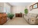 Bright living room with ample natural light, a comfortable sofa, and stylish furnishings for relaxation at 16525 Sanford St, Mead, CO 80542