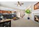 Spacious living room with open floor plan and fireplace flowing into the kitchen at 16525 Sanford St, Mead, CO 80542