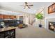 Spacious living room open to the kitchen, with a fireplace and staircase at 16525 Sanford St, Mead, CO 80542