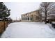 Spacious backyard with snow cover, offering a peaceful winter view at 1035 Cryolite Pl, Castle Rock, CO 80108