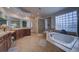 Elegant bathroom with double vanity, soaking tub, and separate shower at 1035 Cryolite Pl, Castle Rock, CO 80108