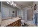 Simple bathroom with shower/tub combo and wood vanity at 1035 Cryolite Pl, Castle Rock, CO 80108