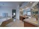 Elegant bathroom with double sinks, a soaking tub, and a view of the bedroom at 1035 Cryolite Pl, Castle Rock, CO 80108