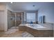 Bathroom featuring a large shower and corner soaking tub at 1035 Cryolite Pl, Castle Rock, CO 80108