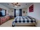 Spacious bedroom with large bed, dresser, and rocking chair at 1035 Cryolite Pl, Castle Rock, CO 80108