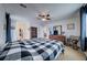 Bright bedroom with a large bed and access to the hallway at 1035 Cryolite Pl, Castle Rock, CO 80108