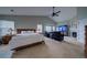 Main bedroom with king-size bed and en-suite sitting area at 1035 Cryolite Pl, Castle Rock, CO 80108