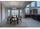 Bright dining room features a large table with seating for six and large windows at 1035 Cryolite Pl, Castle Rock, CO 80108