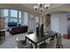 Open concept dining room with seating for six, adjacent to the living room at 1035 Cryolite Pl, Castle Rock, CO 80108