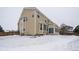 Two-story house with a backyard covered in snow at 1035 Cryolite Pl, Castle Rock, CO 80108