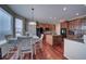 Kitchen dinette area with hardwood floors and window seating at 1035 Cryolite Pl, Castle Rock, CO 80108